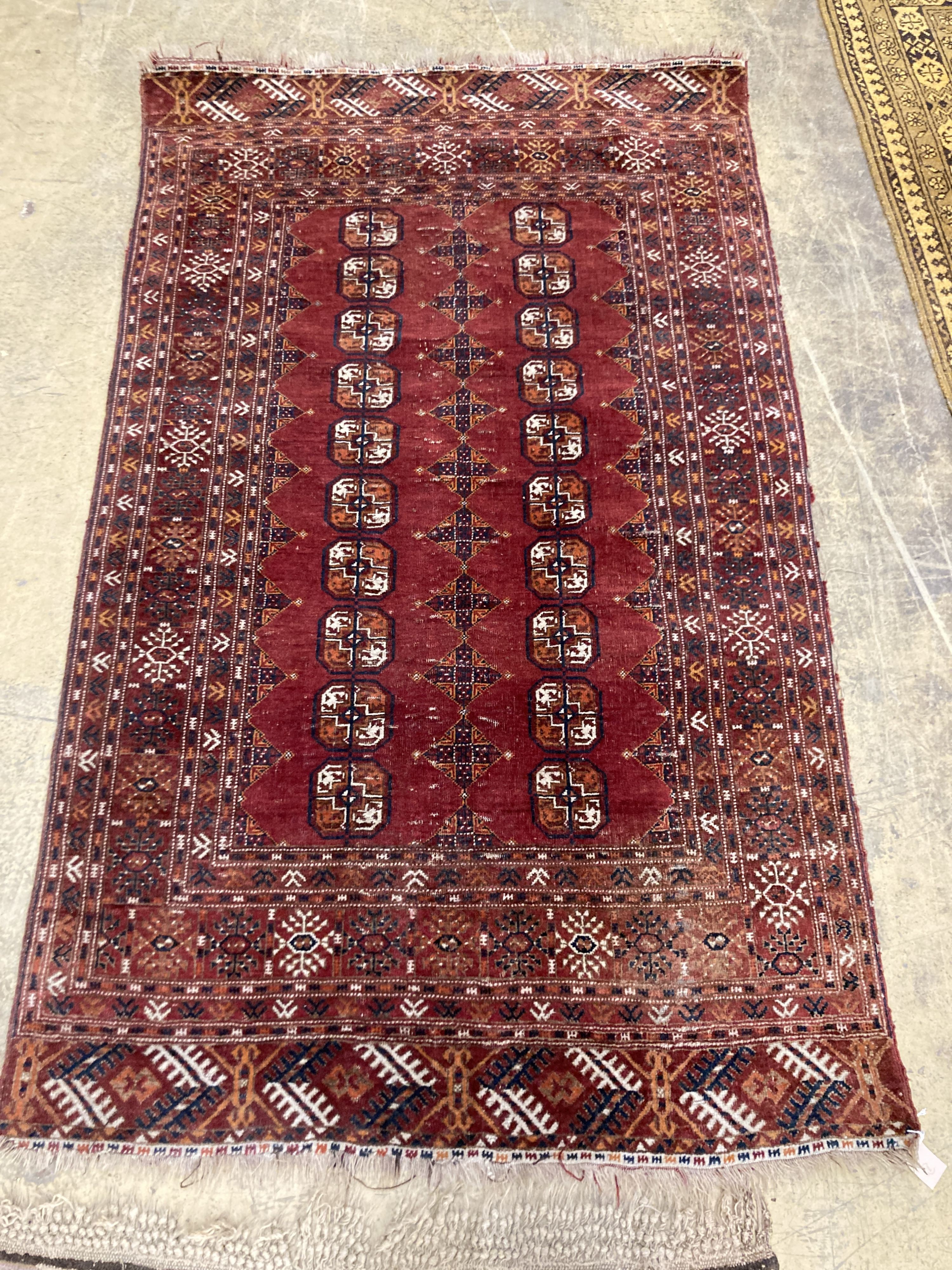 A Bokhara red ground rug, 190 x 114cm